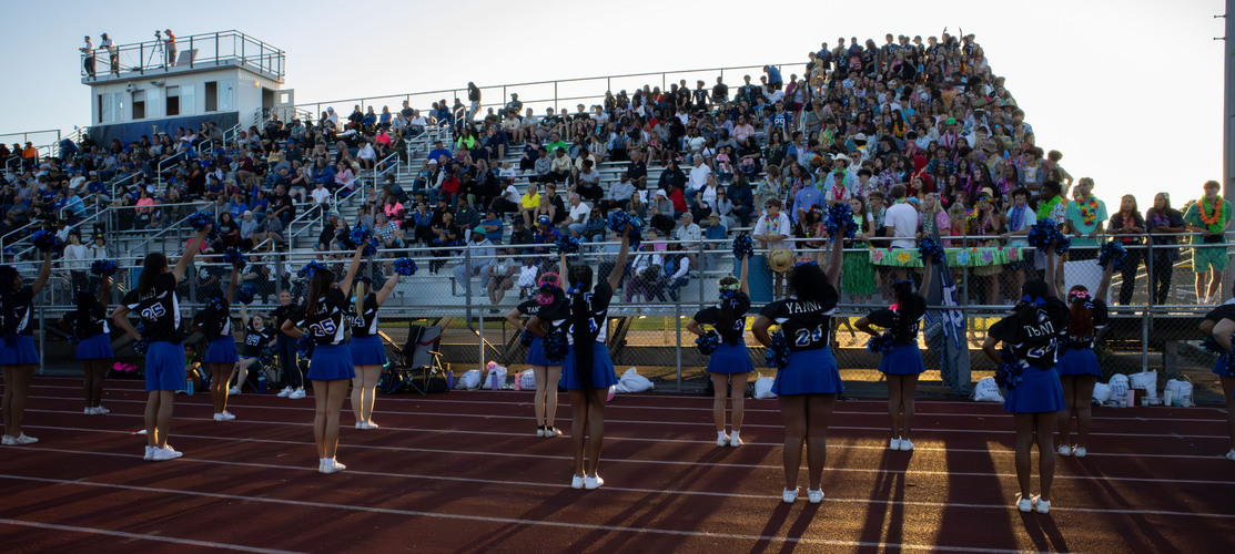 L'Anse Creuse High School Cheerleaders cheering to student section
