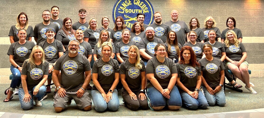 MSS Staff Members wearing new logo t-shirts